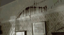 a wall with a lot of blood on it and the words " i 'm sorry " written on it