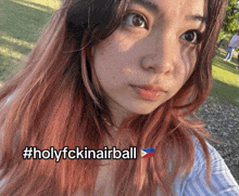 a girl with pink hair is taking a selfie with the hashtag #holyfckinairball