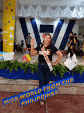 a woman in a sash that says ' miss world from the philippines '