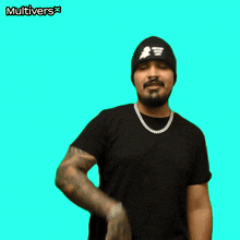 a man wearing a black beanie and a black shirt holds up a bitcoin