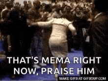 a woman in a white dress is dancing in front of a crowd of people .