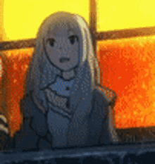 a cartoon girl is sitting in front of a window holding a cat in her hands .