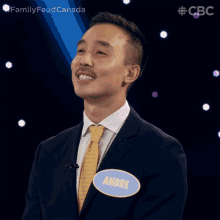 a man with a name tag that says andre