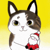 a black and white cat holding a small santa claus doll