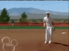 a mickey mouse drawing on a baseball field