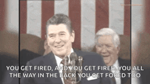 a man speaking into a microphone with the words you get fired