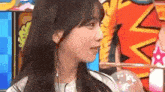 a close up of a woman 's face with a cartoon background .