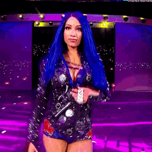 a woman with blue hair is holding a sign that says boss on it
