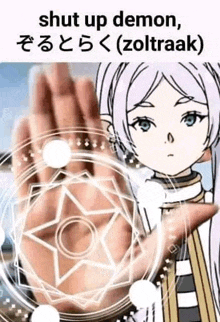 a person is holding a pentagram in their hand in front of a cartoon girl .