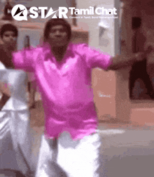 a man in a pink shirt is dancing in front of a star tamil chat banner