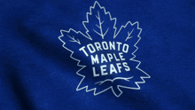 the logo for the toronto maple leafs is displayed on a blue background