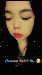 a close up of a woman 's face with the words hemmm sudah ih on the bottom
