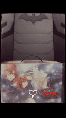 a book titled vampire knight sits on a batman chair