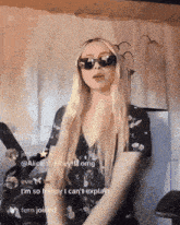 a blonde woman wearing sunglasses and a black dress says i 'm so happy i can 't explain fern joined