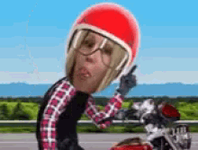 a cartoon of a woman wearing a red helmet and glasses riding a motorcycle