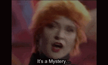 a woman with orange hair is saying it 's a mystery ..