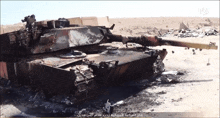 a picture of a burned out tank with arabic writing on the bottom