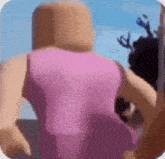 a blurred image of a person in a pink dress standing in front of a blue sky .
