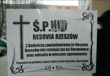 a sign that says s.p. resovia rzeszow with a cross on it