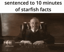 a judge sits at a desk with a gavel in front of him and the words sentenced to 10 minutes of starfish facts