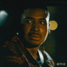a close up of a man 's face with netflix written on the bottom right