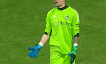 a soccer player wearing a green jersey with the word rain on it