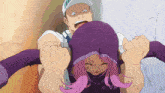 a man is holding a woman in a purple hood