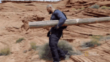 Carrying A Log Dave Bautista GIF - Carrying A Log Dave Bautista Dave Bautista Makes A Log Ladder GIFs