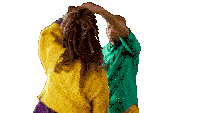 a man in a green shirt holds a woman 's hair in his hands