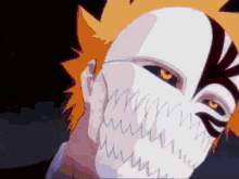 a close up of a person wearing a mask with sharp teeth