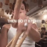 a man is holding a rope with the words then do it btch written above him .