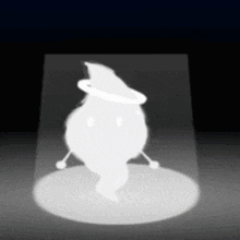 a white ghost with a witch hat and a halo around its head is standing in a dark room .
