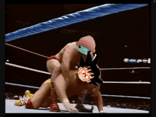 a cartoon of a man carrying another man in a wrestling ring with the letter w on the bottom
