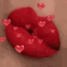 a close up of a woman 's red lips with hearts surrounding them .