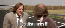 two men standing on a highway with the words et les distances written above them