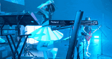 a woman is jumping in the air while playing a keyboard that says roland