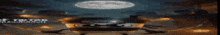 a blurred image of a space ship with the word kumanon written on it