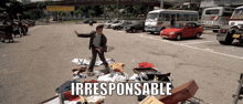 a man standing in a parking lot with the words irresponsible written on the bottom