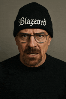 a man wearing a black beanie with the word blazzard on it