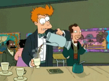 a man in a tuxedo is pouring coffee into a cup