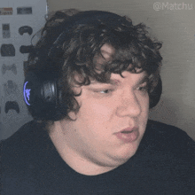 a man wearing headphones has the hashtag @matchu on the bottom of his photo