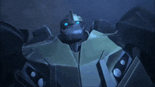 a close up of a robot with blue eyes in the dark