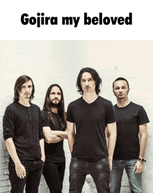 a group of men standing in front of a white wall with the words gojira my beloved on top