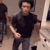 a man in a black t-shirt with the word stay on it