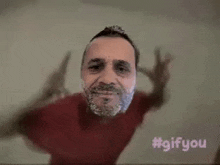 a man with a beard is making a funny face with his arms outstretched .