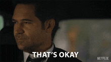 a man in a suit says that 's okay in a netflix ad