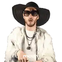 a man wearing a fur coat and a hat with the word mcdh on the bottom left