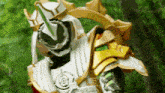 a close up of a person wearing a costume with a sword and shield .
