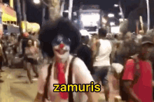 a man dressed as a clown is walking down a crowded street and says zamuris .