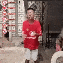 a man in a red shirt with the number 2 on it is dancing